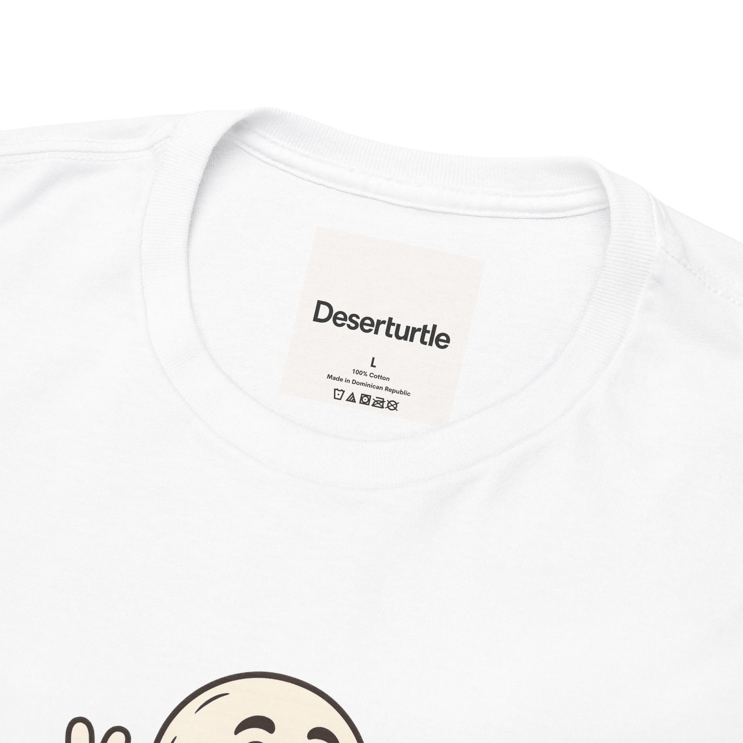 Close-up of Deserturtle neck label inside white t-shirt with visible cartoon print below
